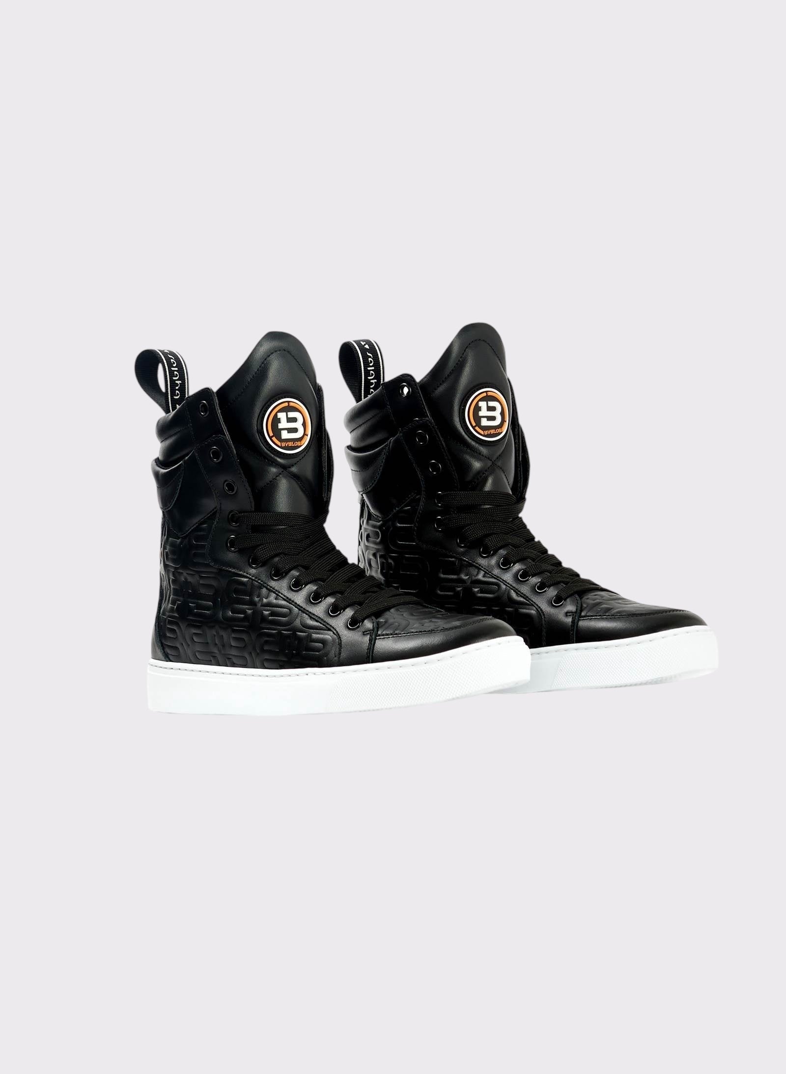 Black high-top sneakers with brand logo on a white background