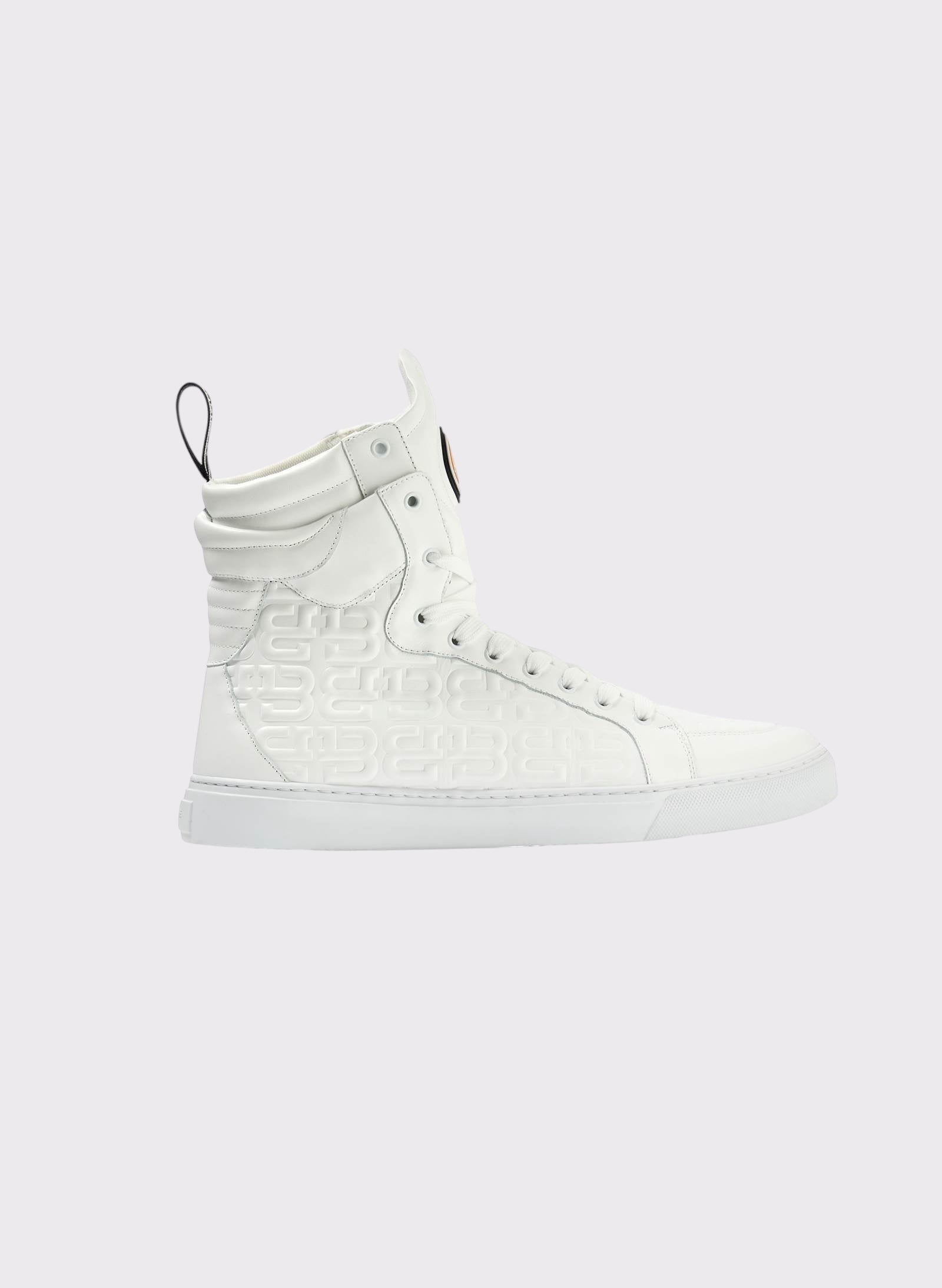 White high-top sneaker on a light gray background