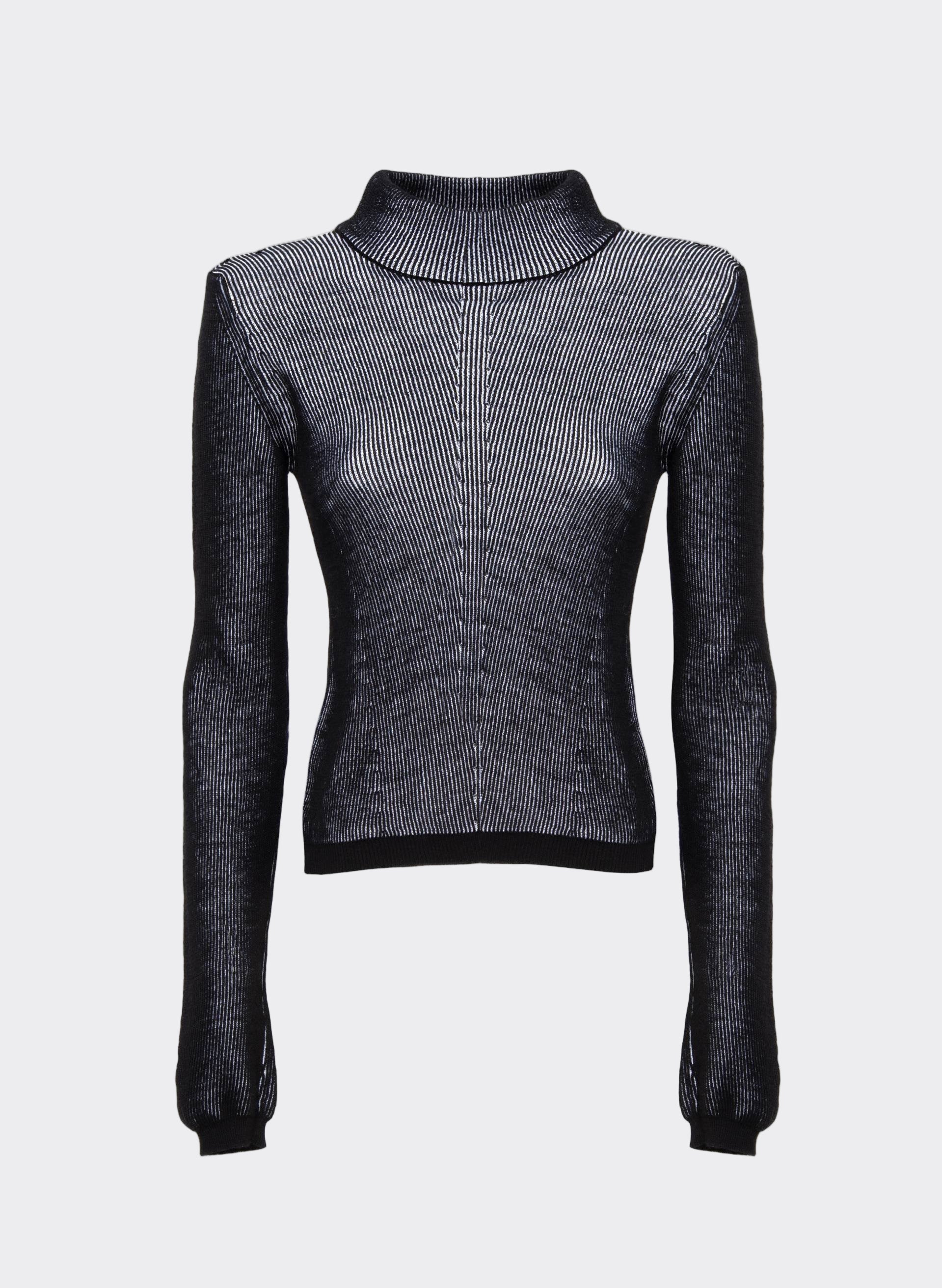 A black and white mixed bi-color knit crop top with a high neck and long sleeves.